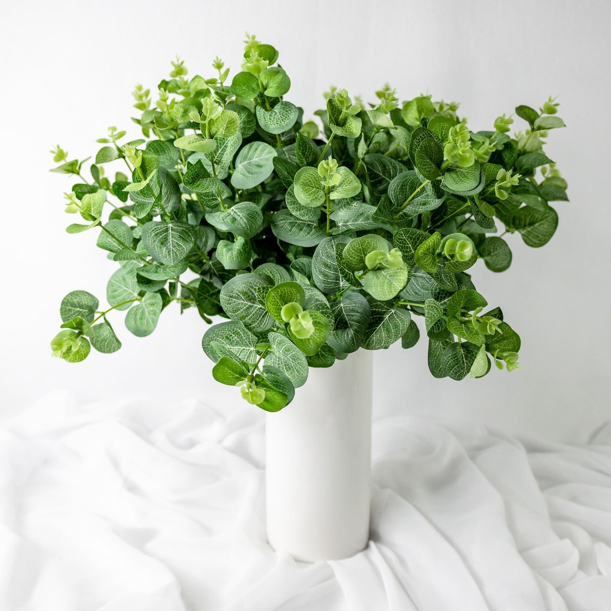 artificial Green Felt Gum in white vase