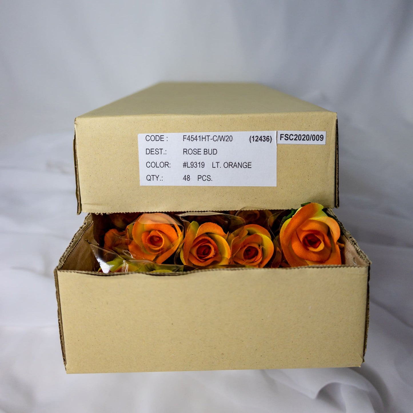 artificial Orange Velveteen rose Buds inside the box