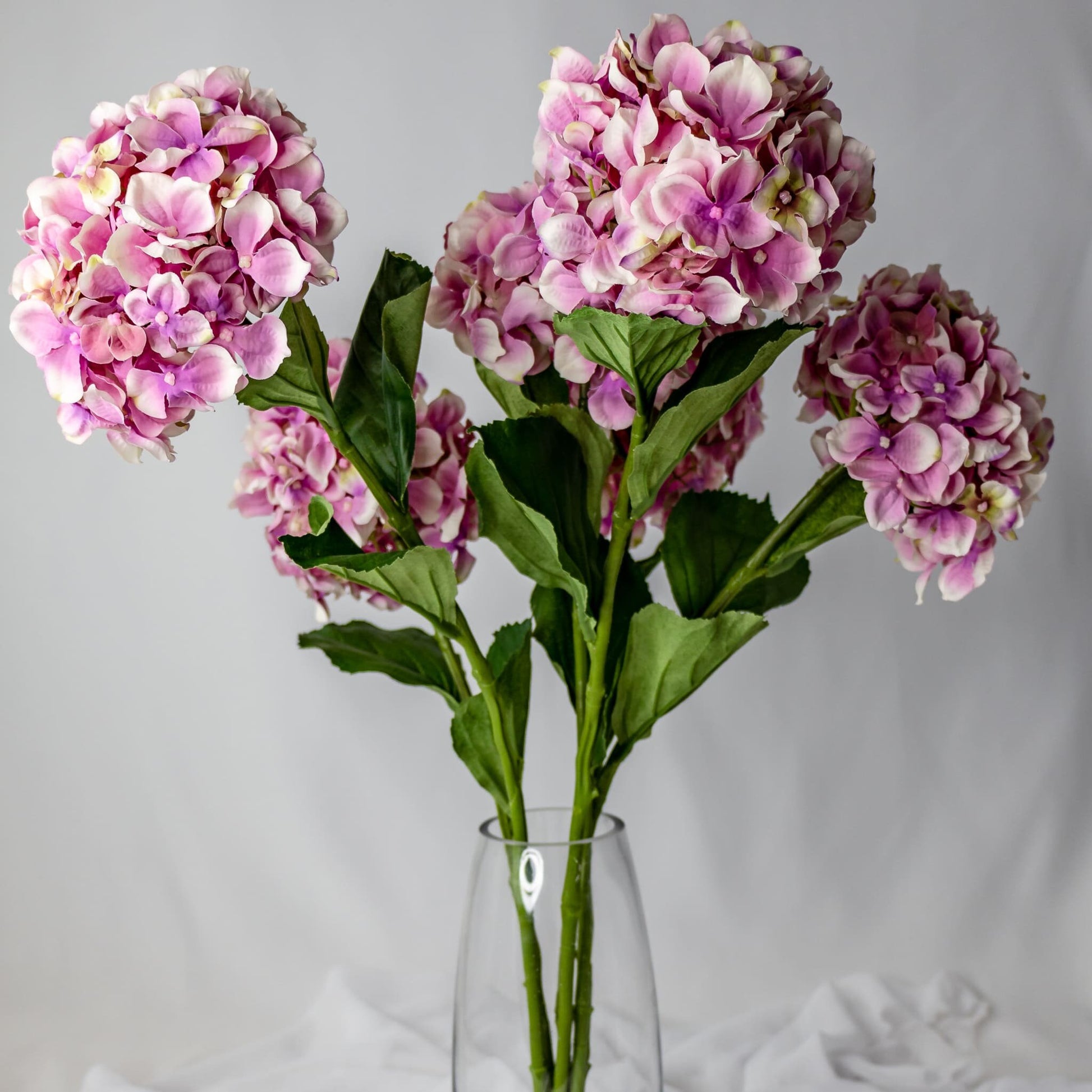 artificial Soft Pink Hydrangea in clear glass vase