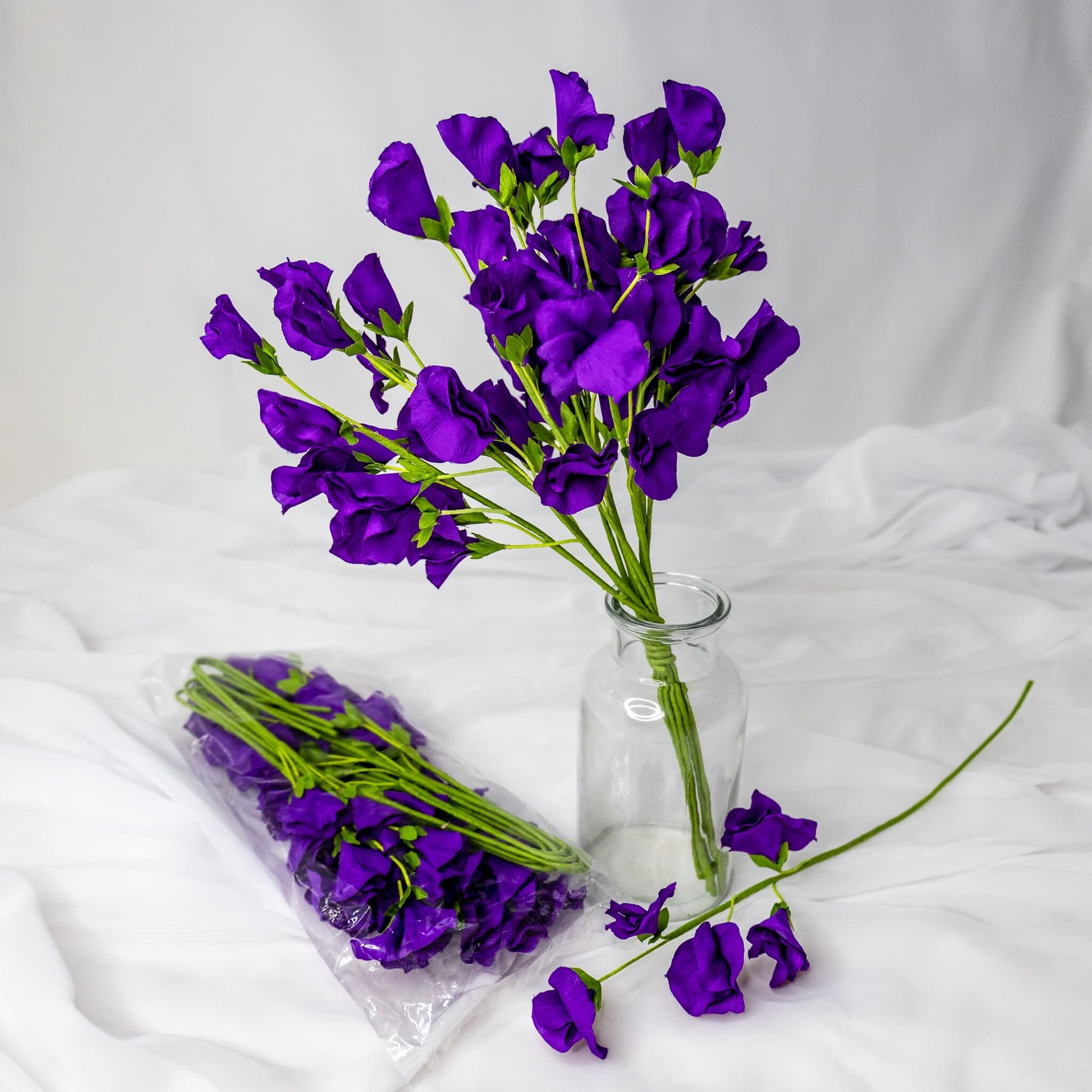 artificial Purple Sweet Pea in clear glass vase