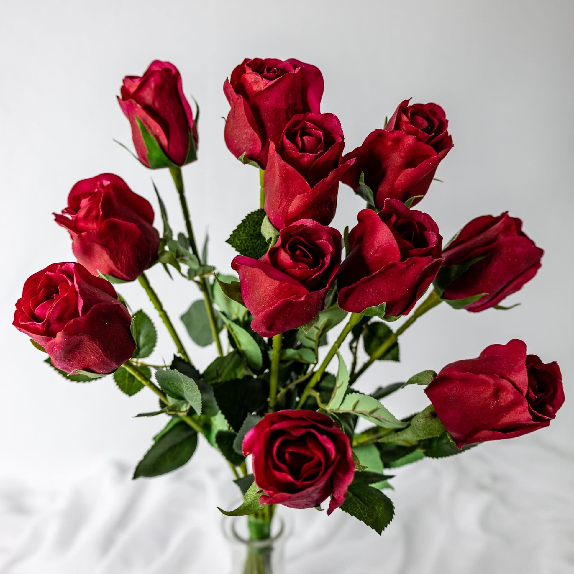 artificial Red Real Touch Open Bud Roses in clear glass top view