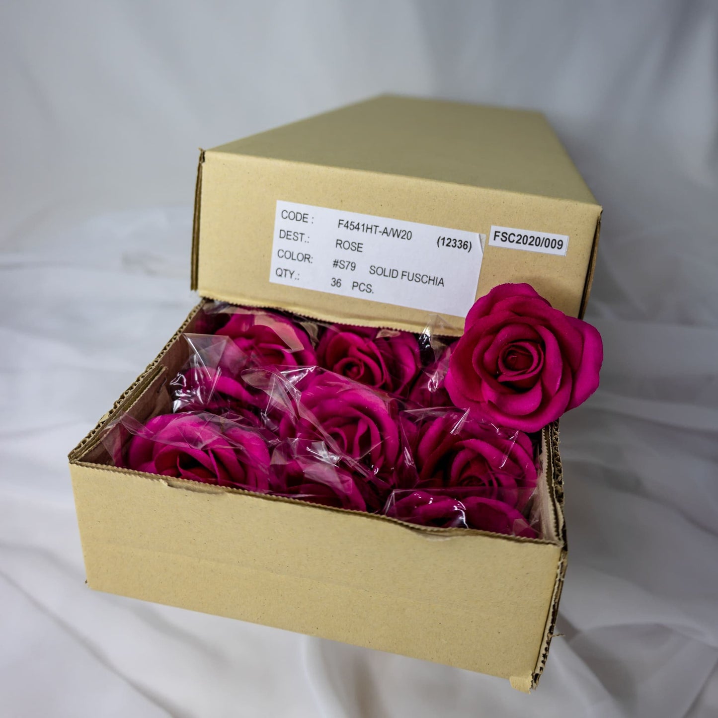 artificial Solid Fuschia Velveteen Bloom roses inside the box