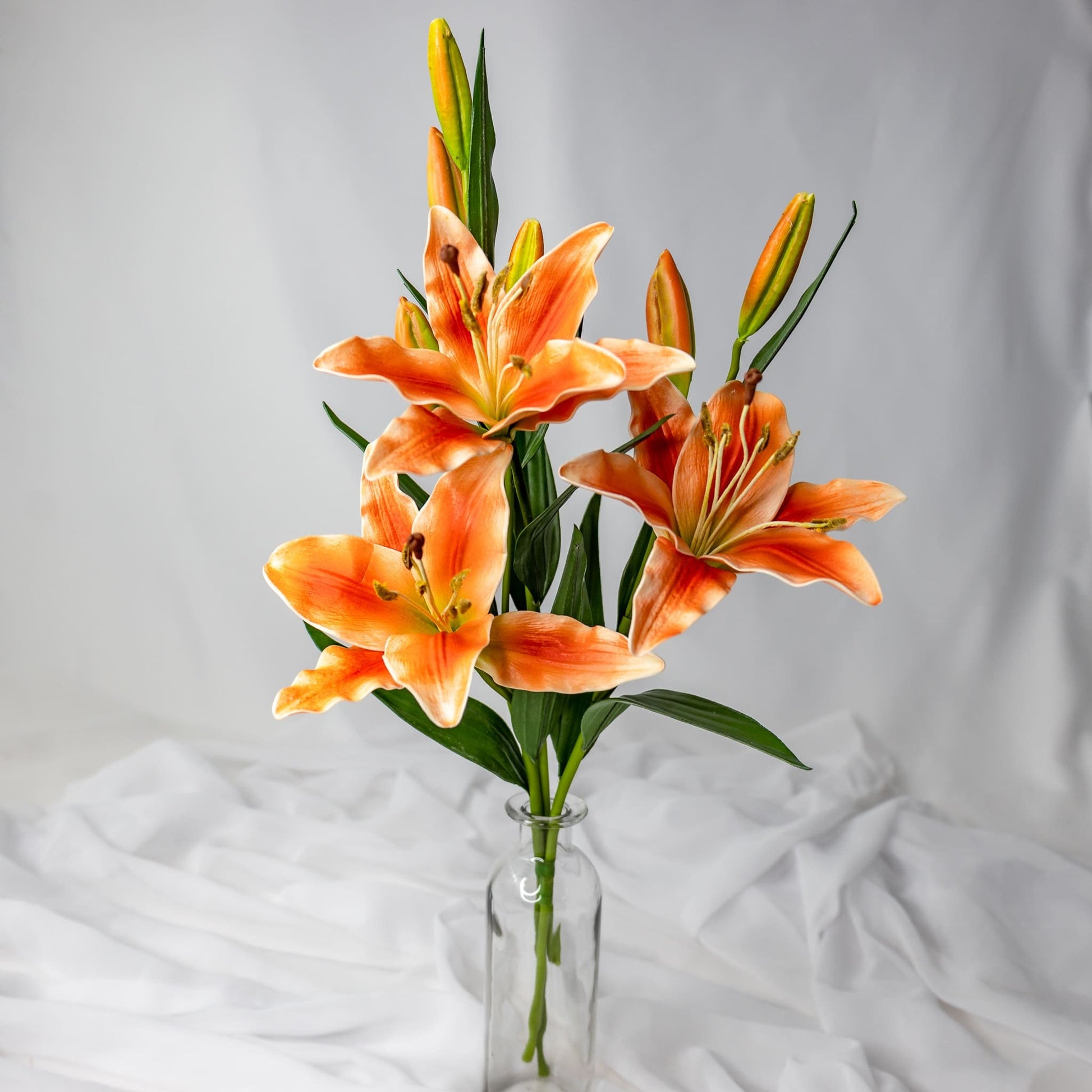 artificial Orange Asiatic Lilies Small in clear glass vase