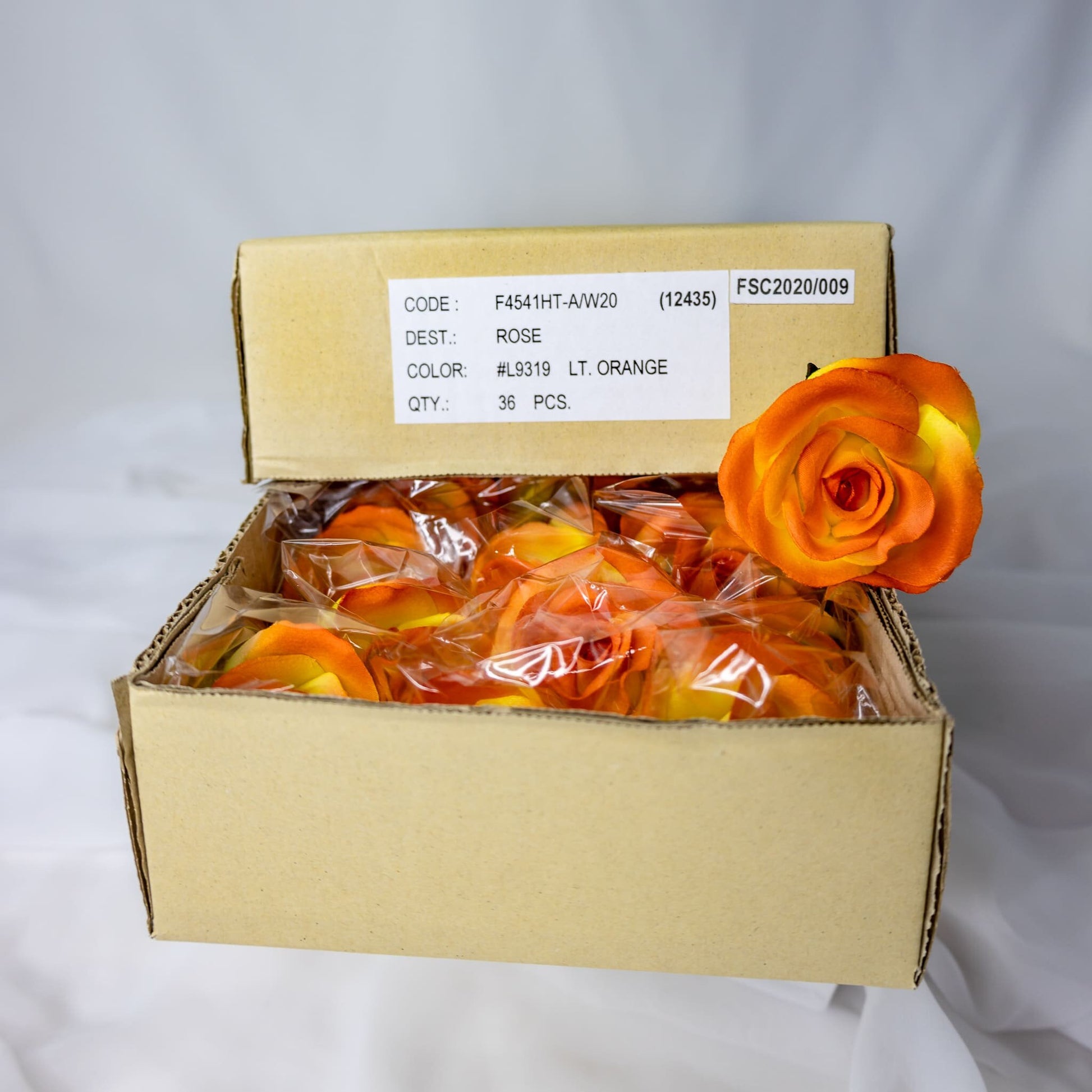 artificial Orange Velveteen Bloom roses inside box