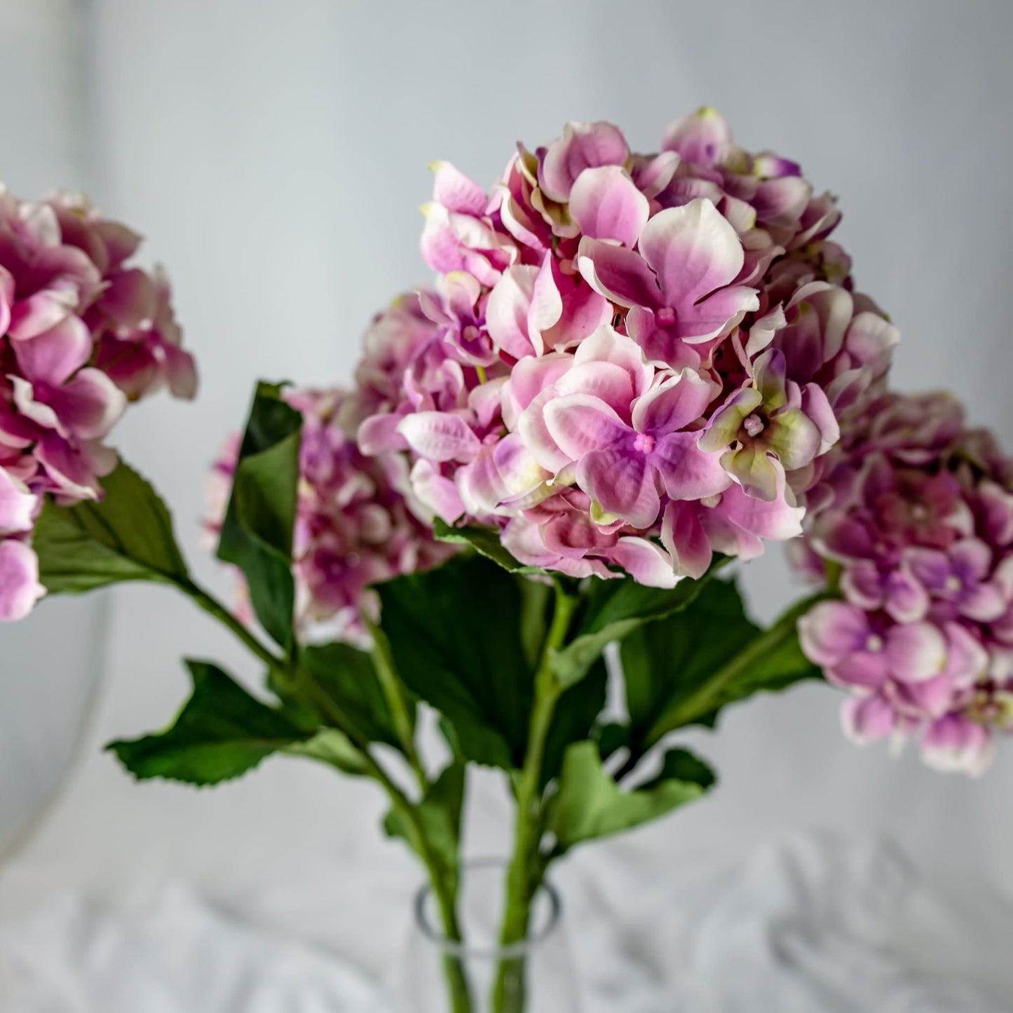 artificial Soft Pink Hydrangea in clear glass vase