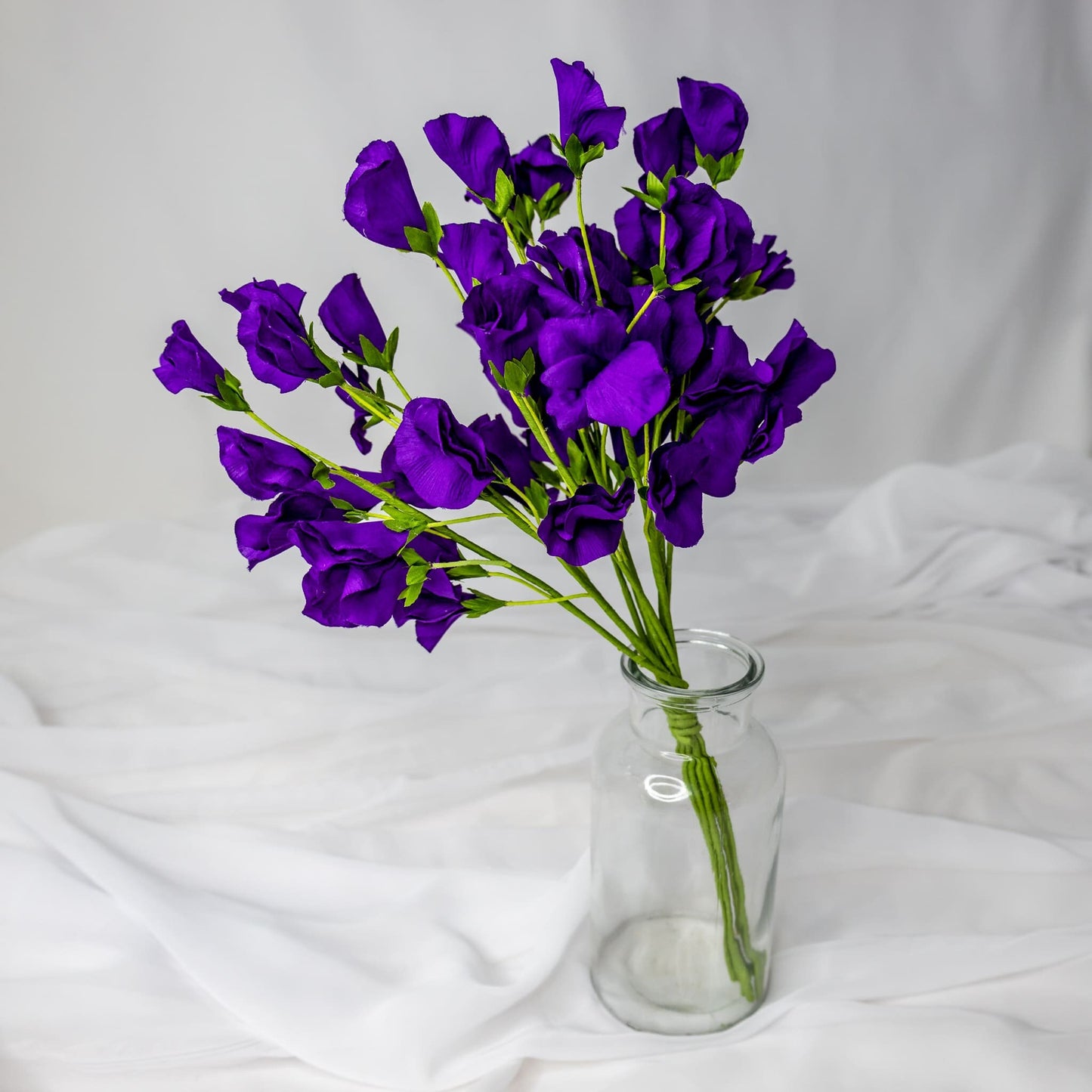 artificial Purple Sweet Pea in clear glass vase