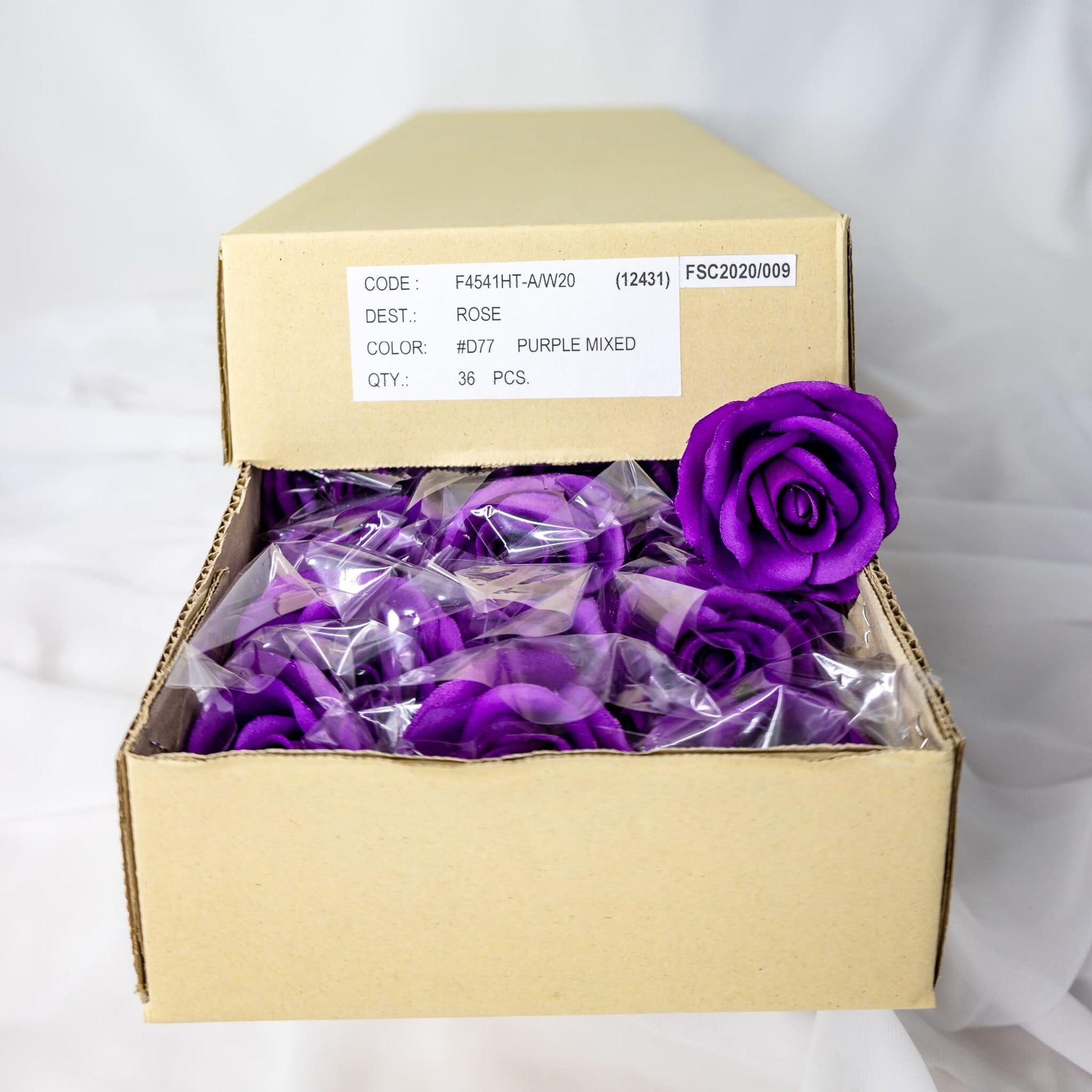 artificial Purple Velveteen Bloom roses inside the box