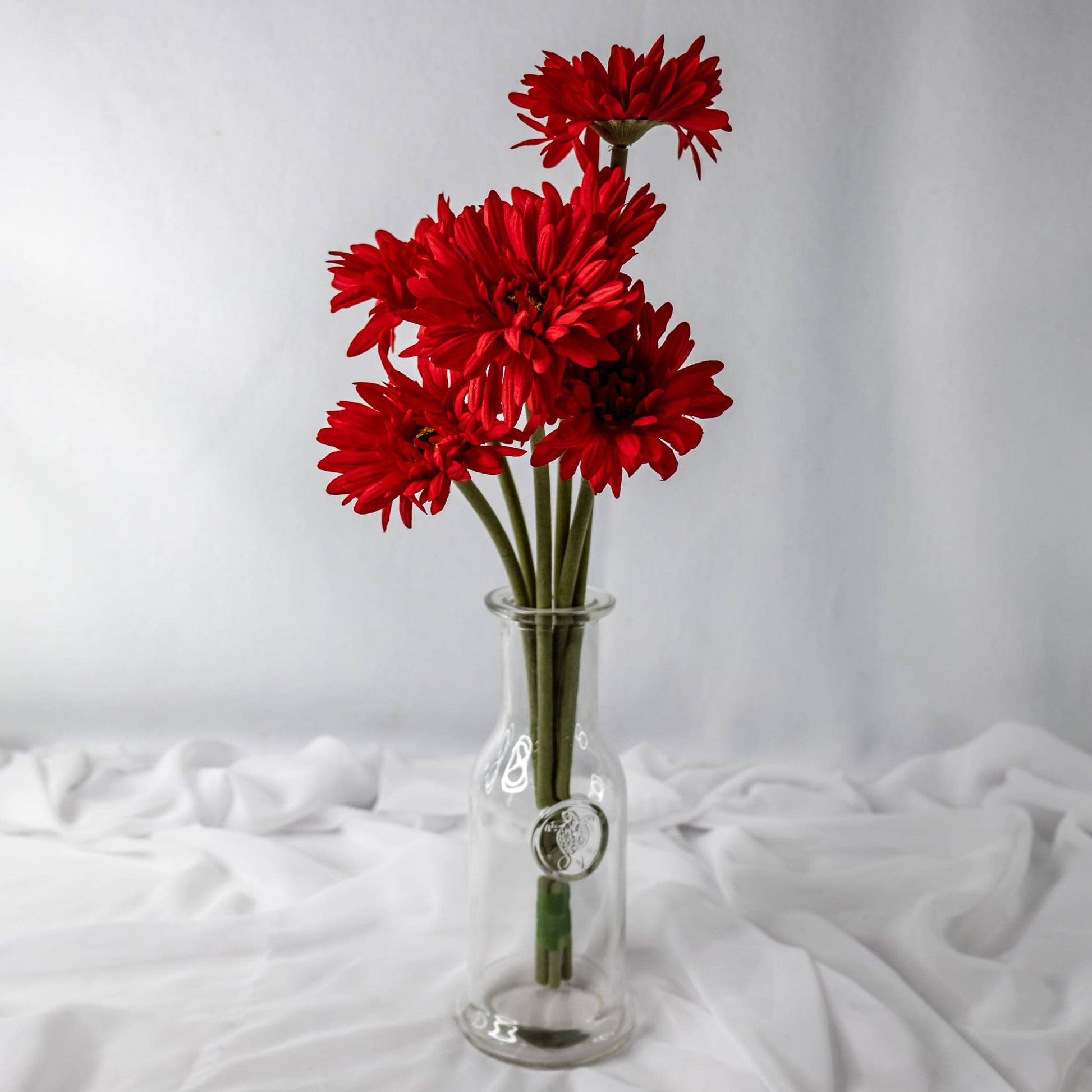 artificial Red Gerbera in glass vase