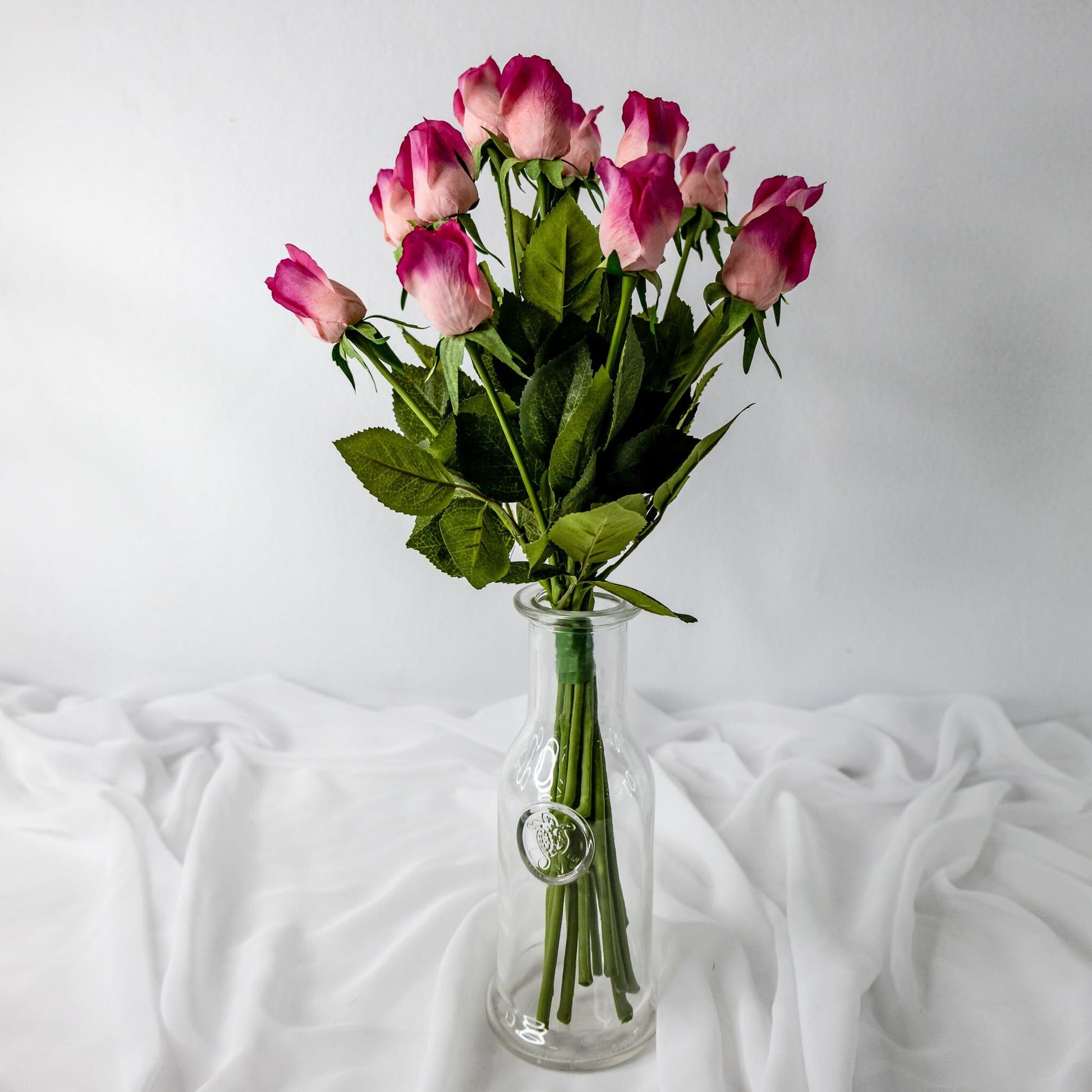 artificial Fuchsia Real Touch Rose Buds in glass vase