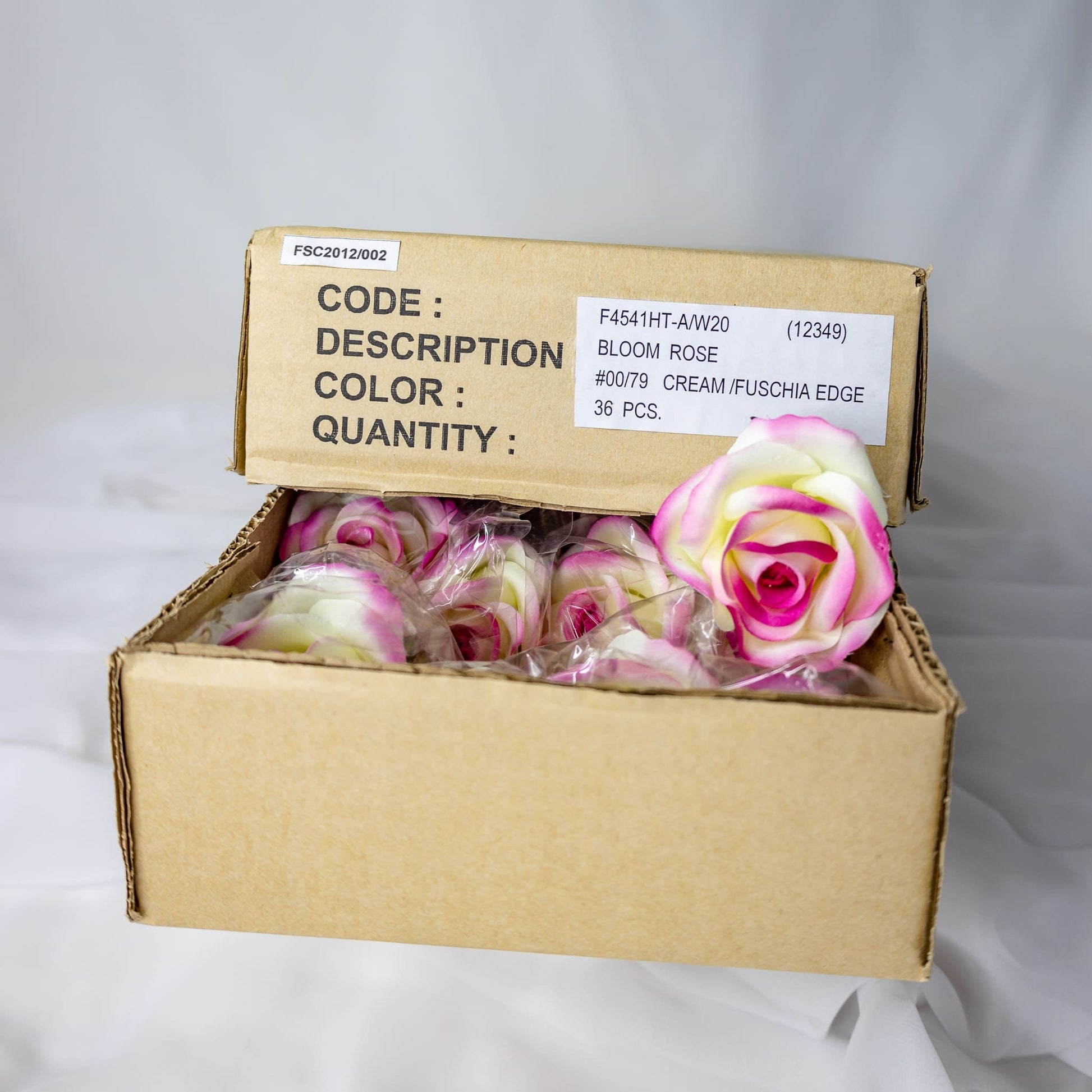 artificial Cream/Fuchsia Velveteen Bloom inside the box