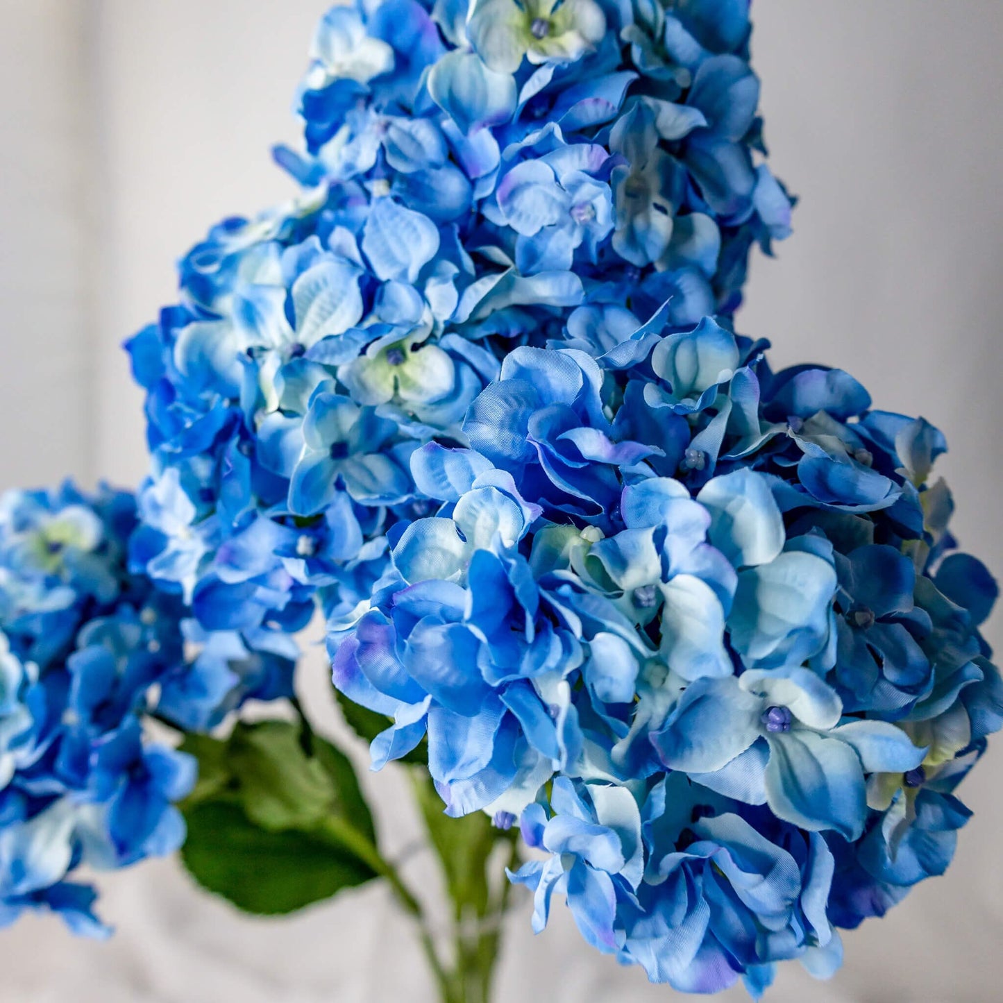 artificial Blue Hydrangea Soft Touch in glass vase closer look