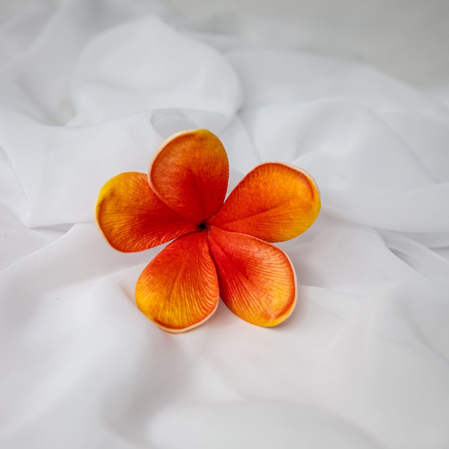 artificial tangerine frangipani flower