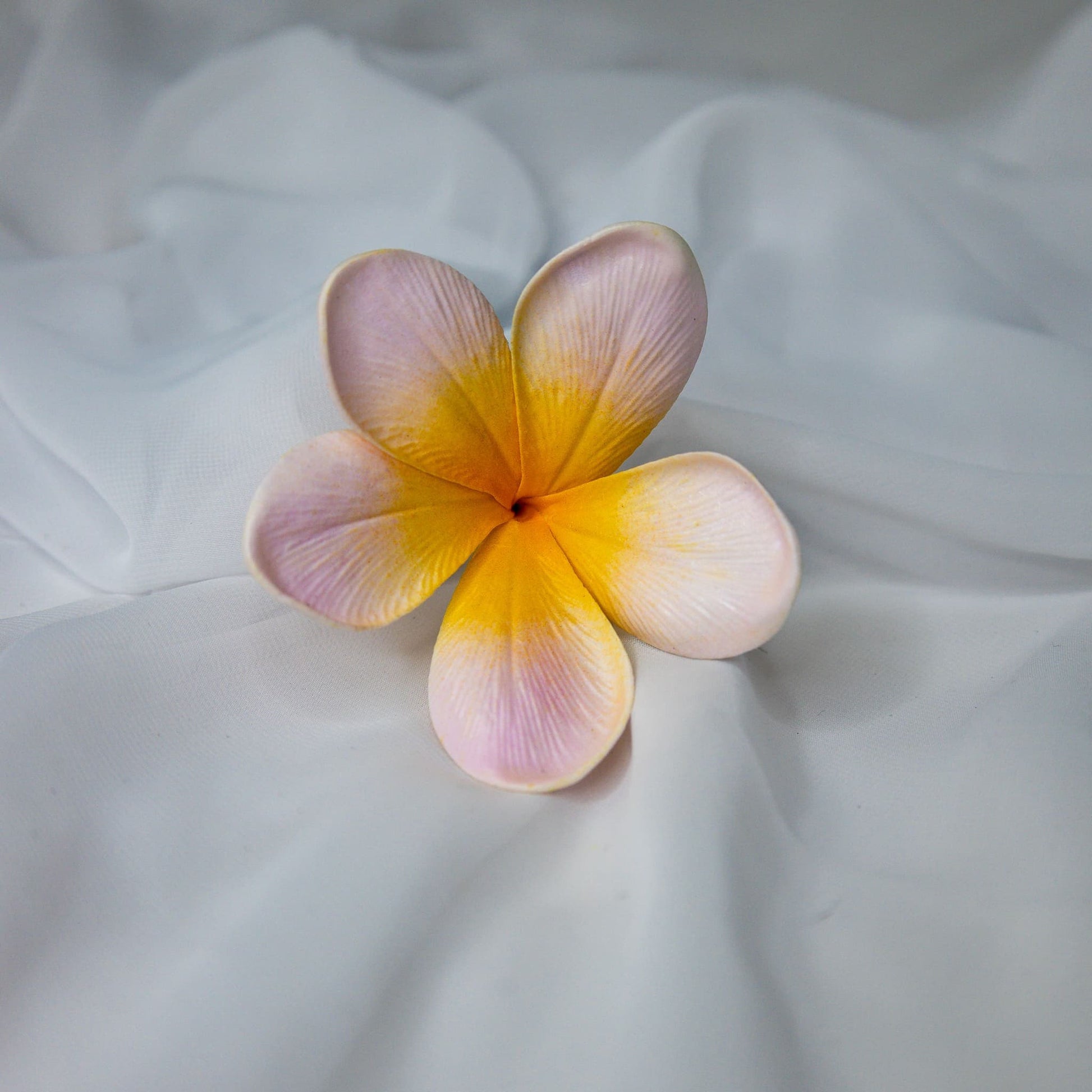 artificial pale frangipani flower