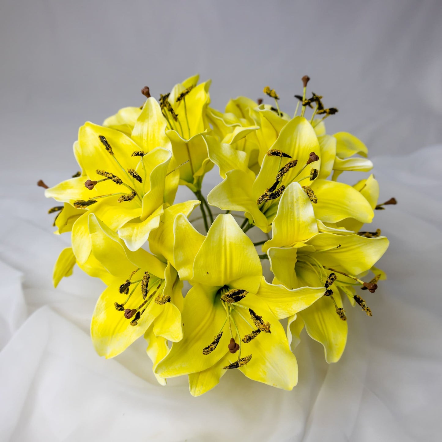 artificial Yellow Asiatic Lily Flowerhead in clear glass vase top vase