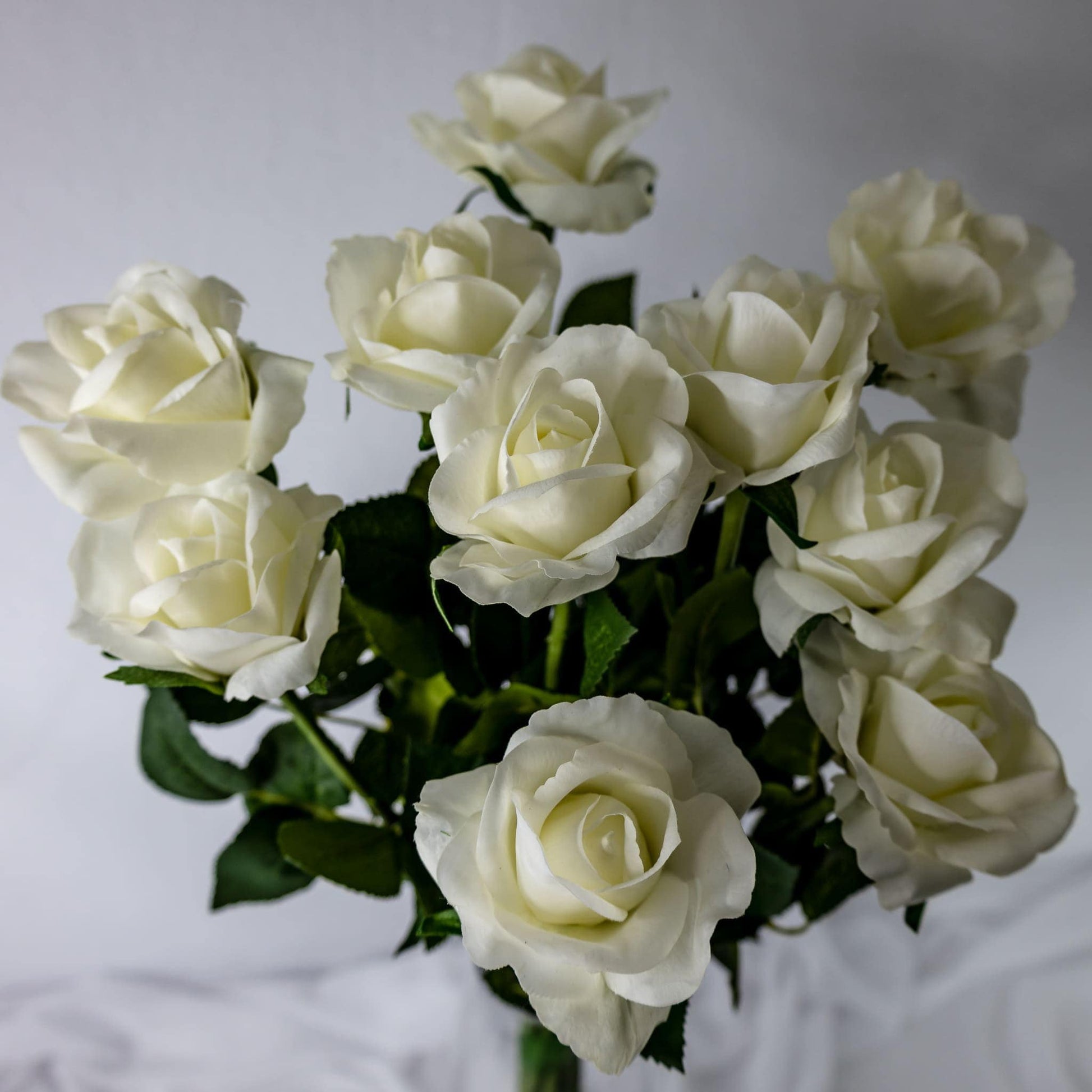artificial white open bloom roses top view