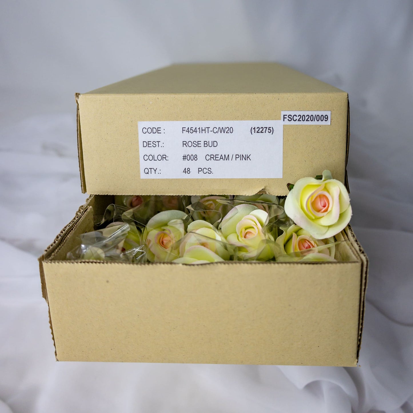 artificial white pink velveteen rose buds inside thr box