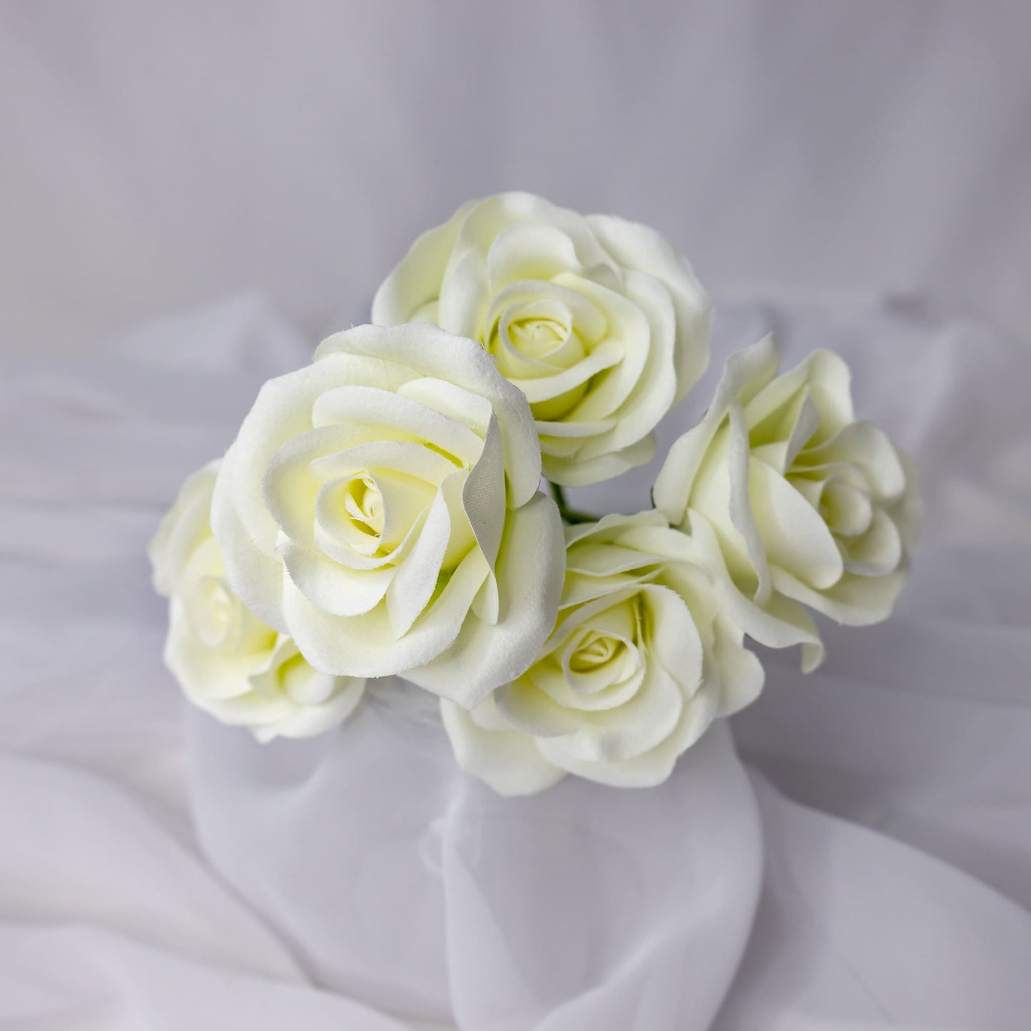 artificial white velveeten roses top view