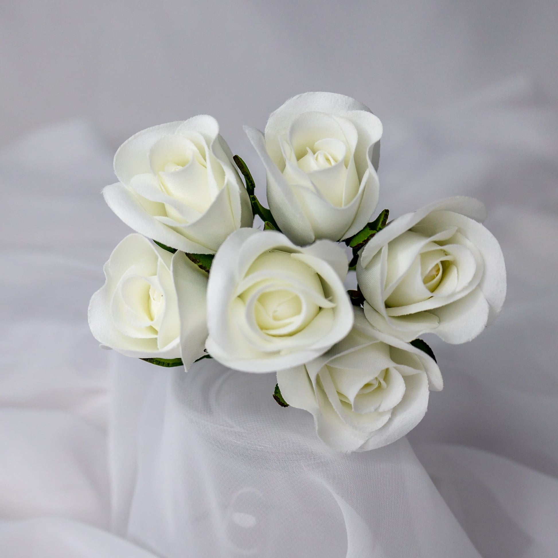 artificial white velveeten rose buds top view