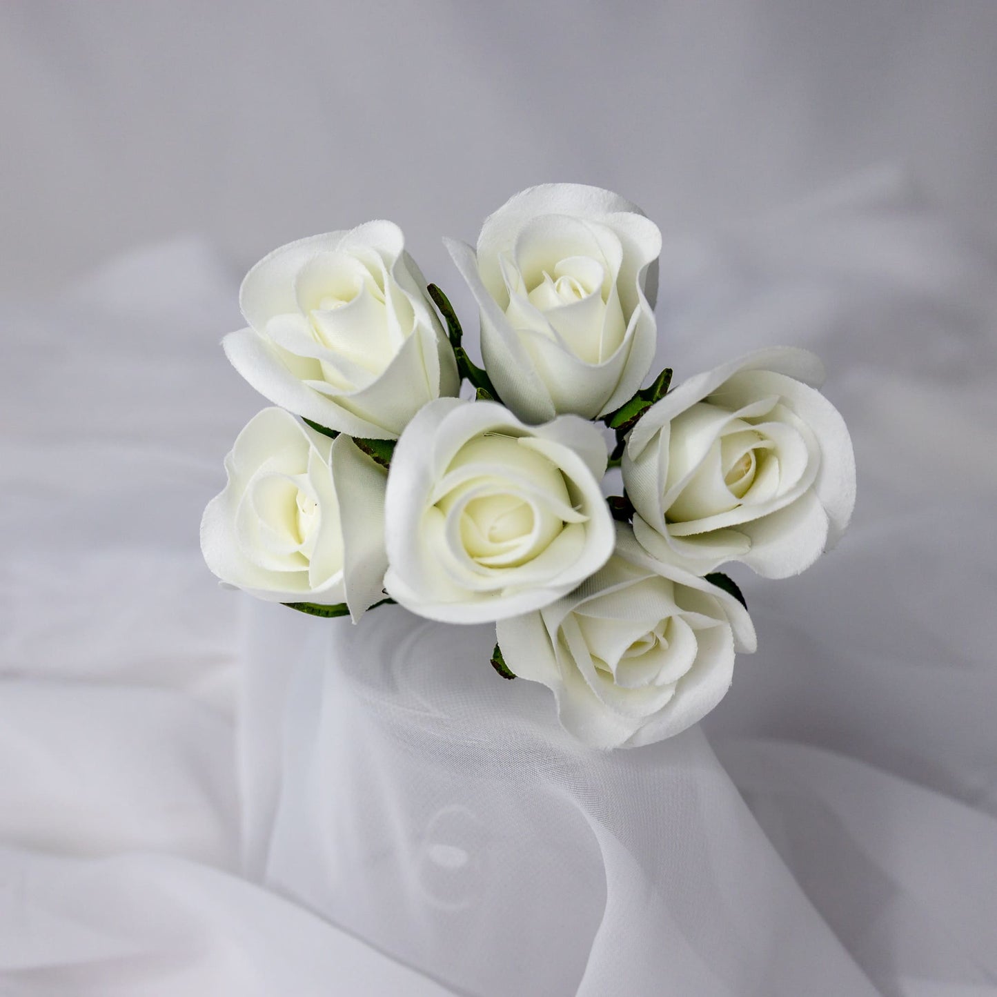 artificial white velveeten rose buds top view