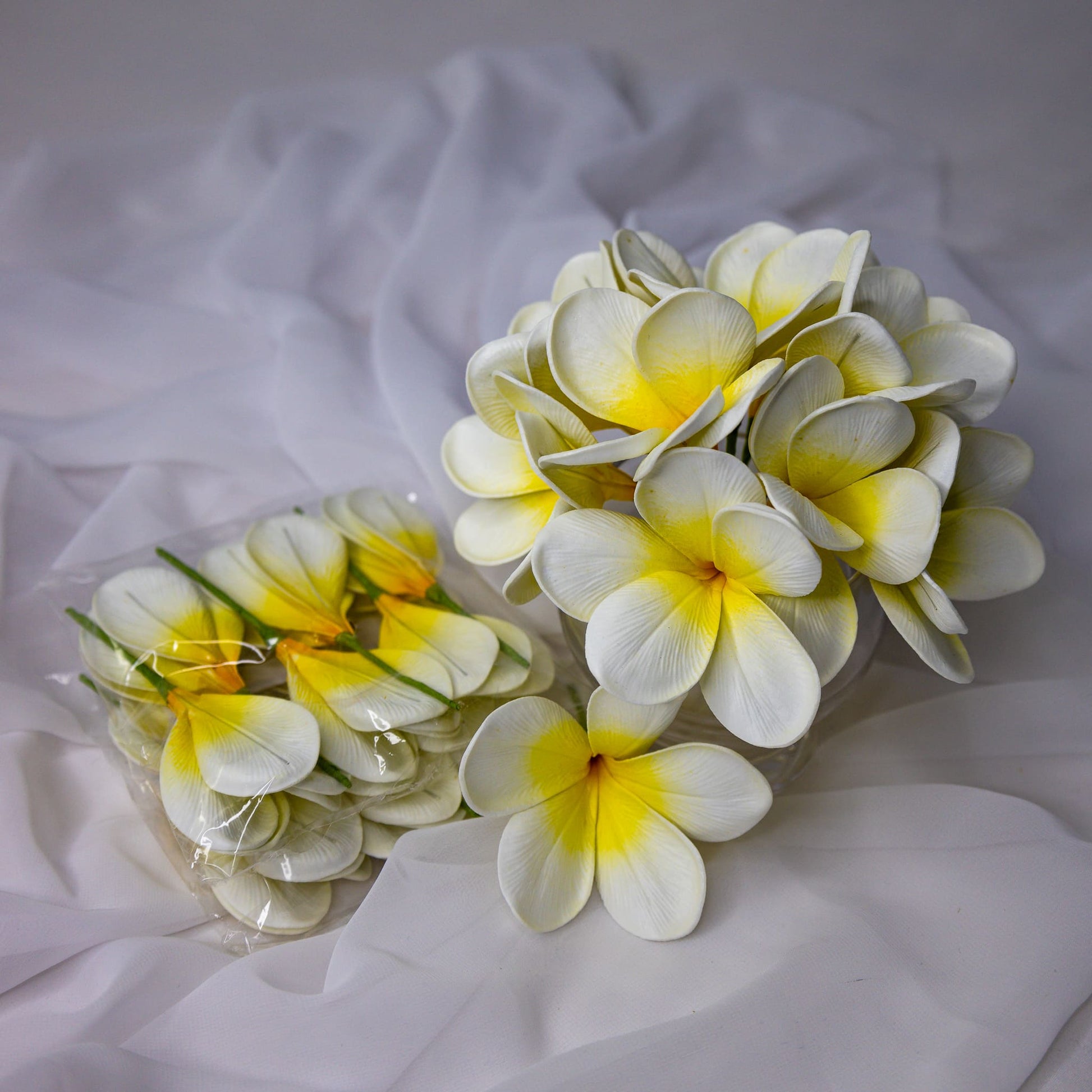 artificial White Yellow Frangipani Flowerhead in glass vase