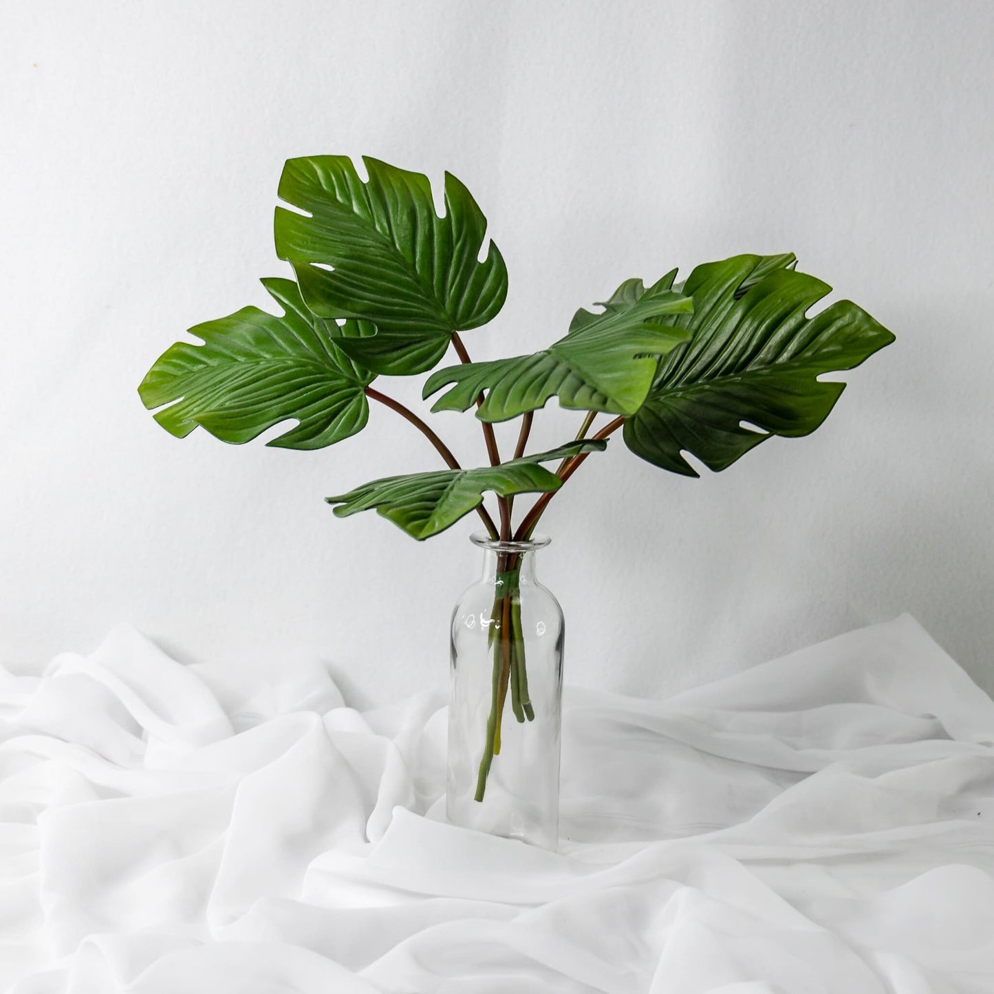 artificial Mini Monstera Leaves in clear glass vase