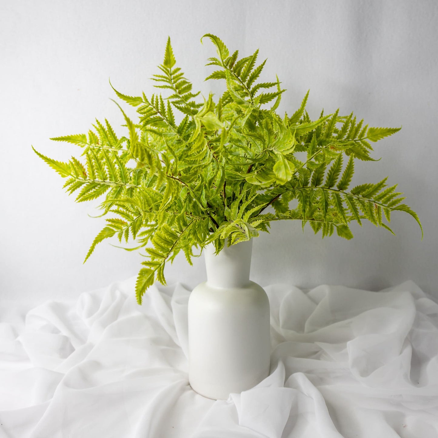 artificial Tuber Ferns in white vase