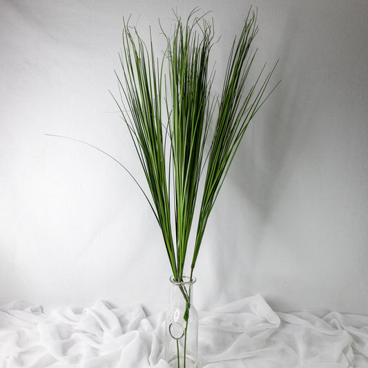 artificial Onion Grass in clear glass vase