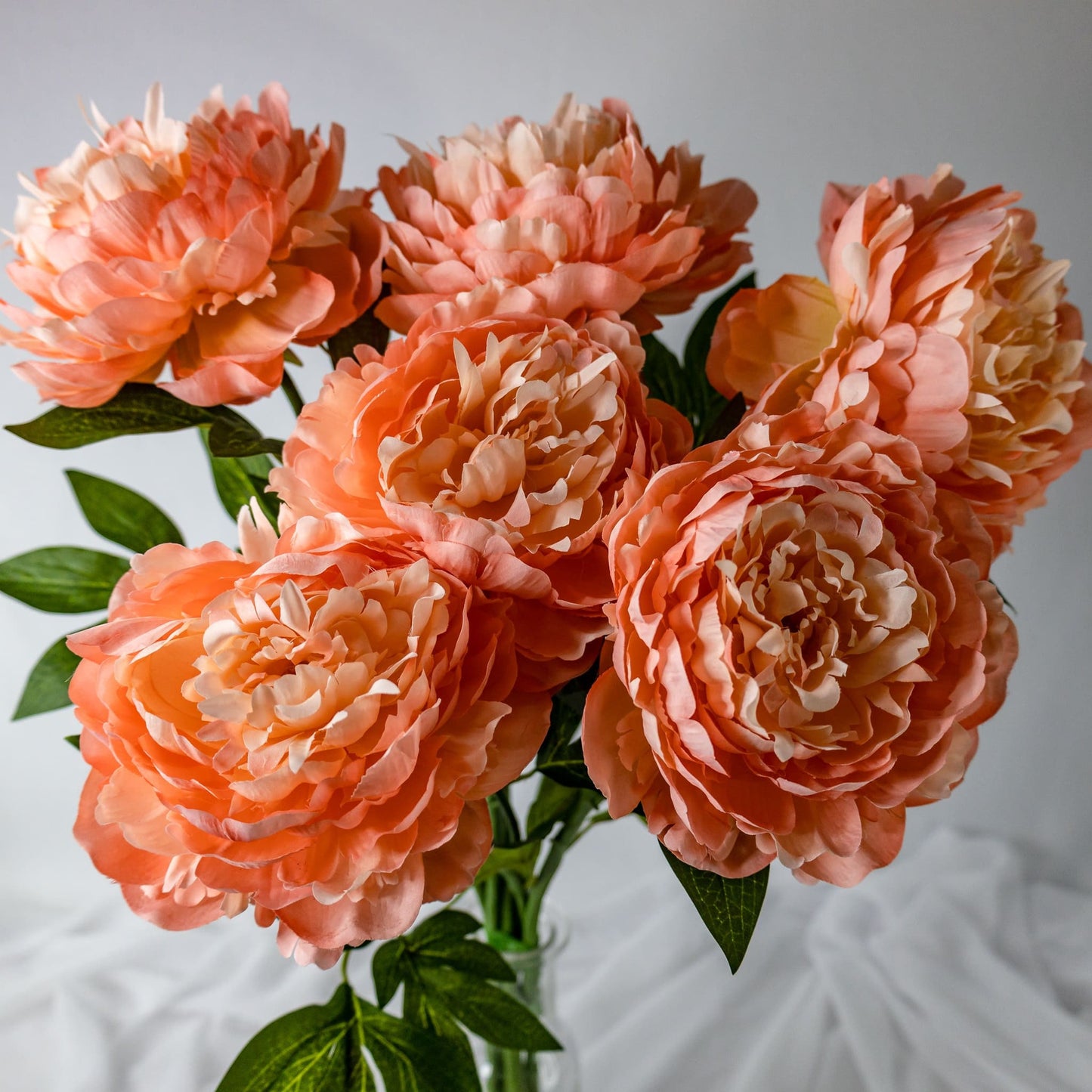 artificial Peach Peonies Large Bloom in clear glass vase top view
