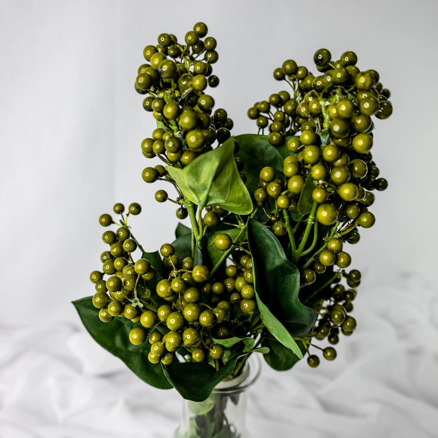 artificial green berry in glass vase closer look