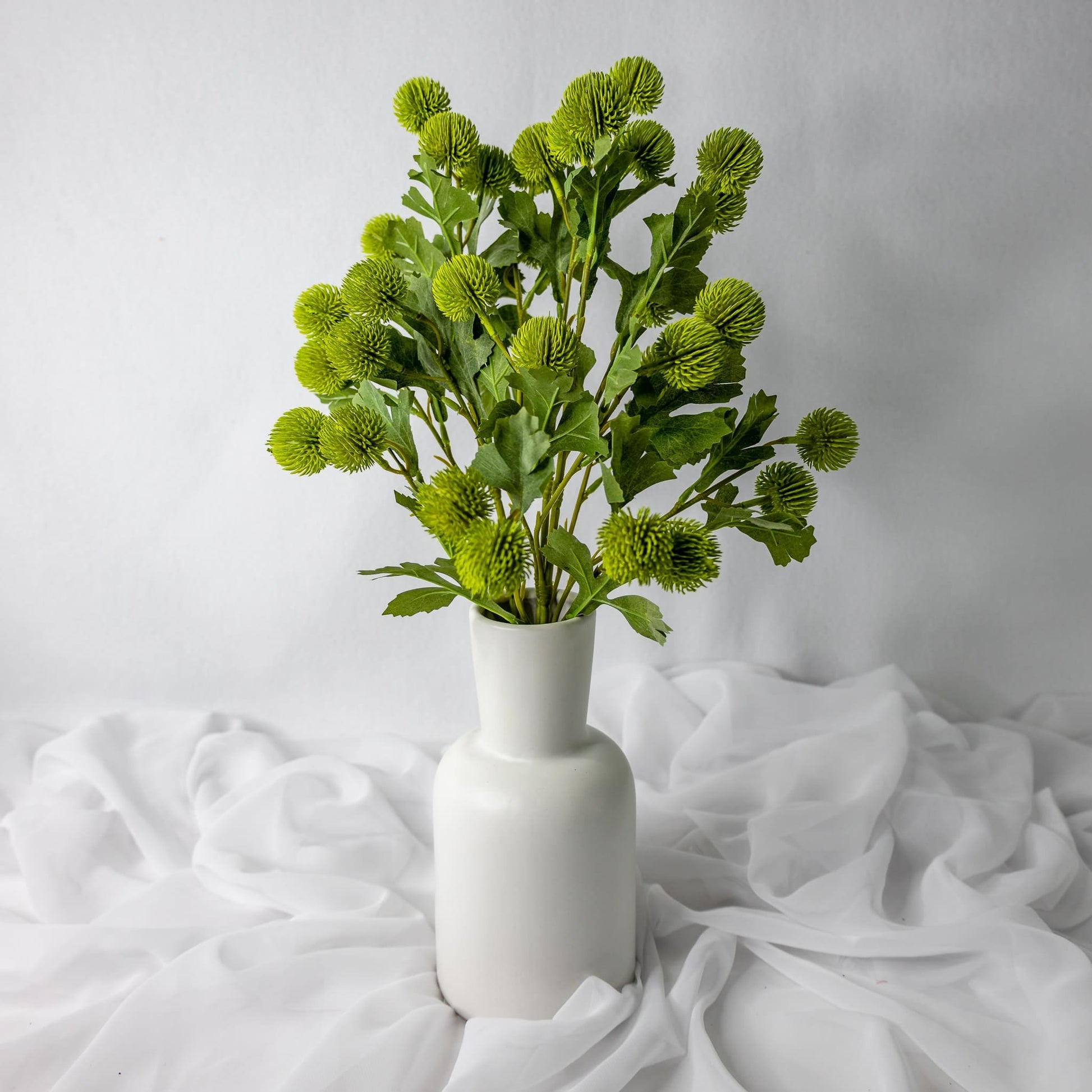 artificial Green Pom Pom Spray in white vase
