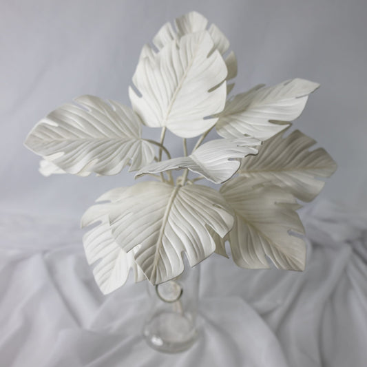 artificial White Mini Monstera Leaves in clear glass vase